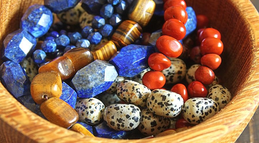  Beautiful semiprecious stone bead bracelets in wooden bowl