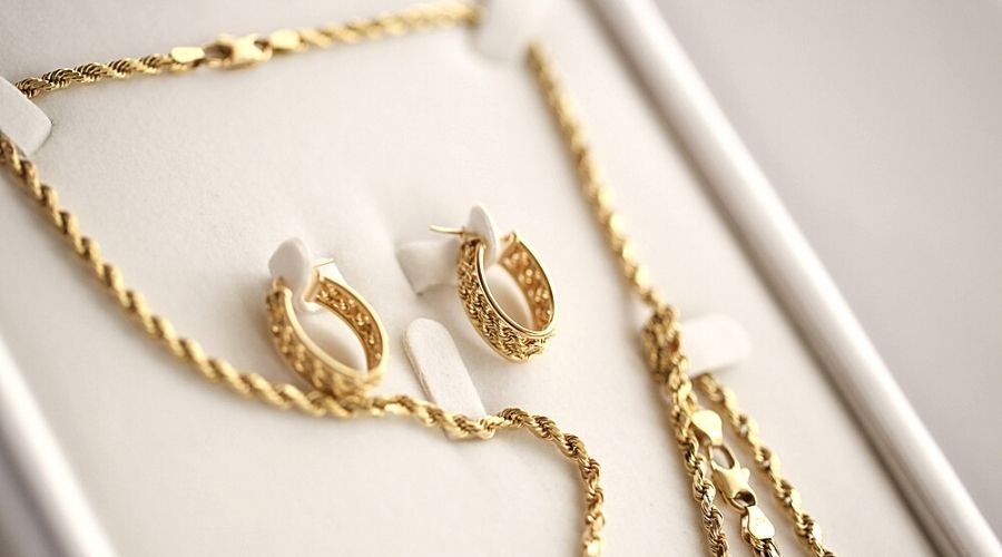 Close-up of a gold earring and necklace set