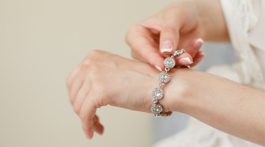 beautiful hands of a woman wearing diamond bracelet