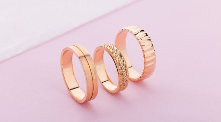 close up of rose gold wedding band set